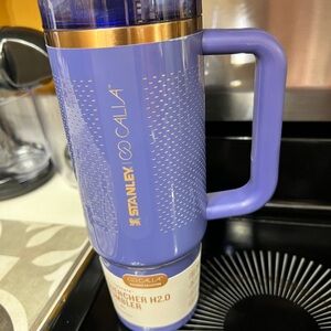 Stanley Purple Travel Mug with Gold Accents and Handle